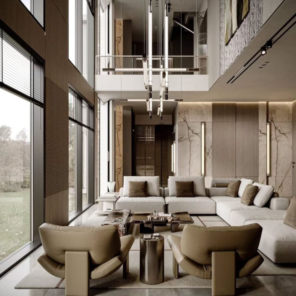 A luxury villa designed with wide, open living spaces and soft natural tones. Large windows bring sunlight across marble and wood finishes, while the clean layout creates a balance of elegance and comfort. Perfect inspiration for modern villa interiors in Dubai — where grand design meets calm living.