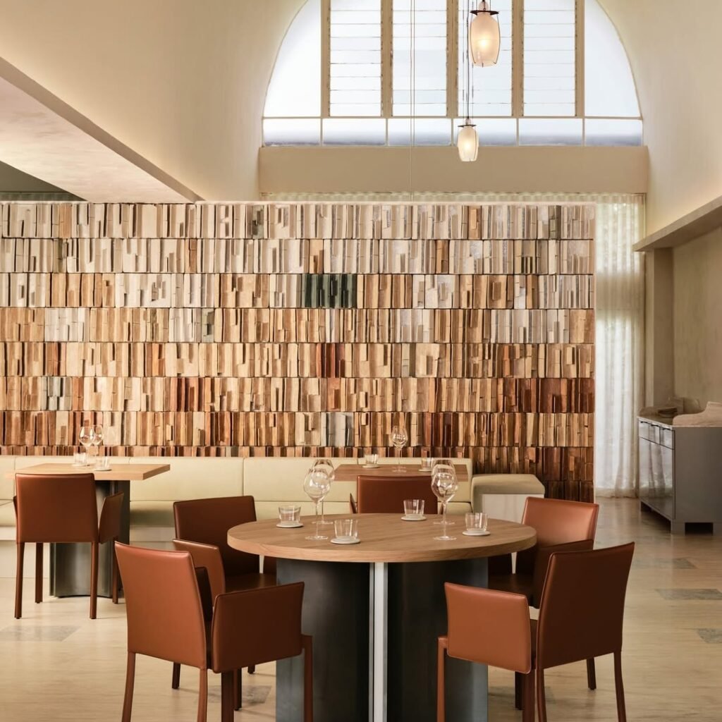 Modern Restaurant Dining Area with Arched Window and Wood Accent Wall | Restaurant Interior Design